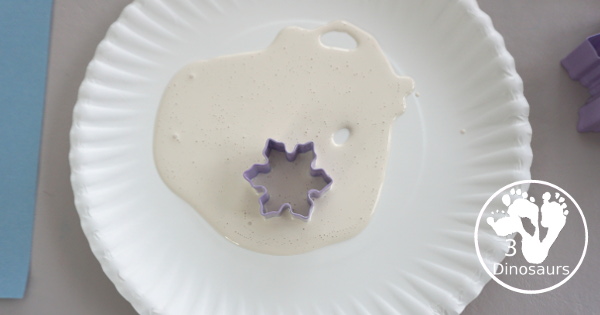 Making Snowflakes - Snowflake Cookie Cutter Painting - a simple painting craft that different ages of kids can do - 3Dinosaurs.com