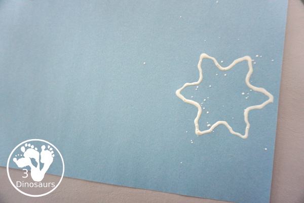 Making Snowflakes - Snowflake Cookie Cutter Painting - a simple painting craft that different ages of kids can do - 3Dinosaurs.com