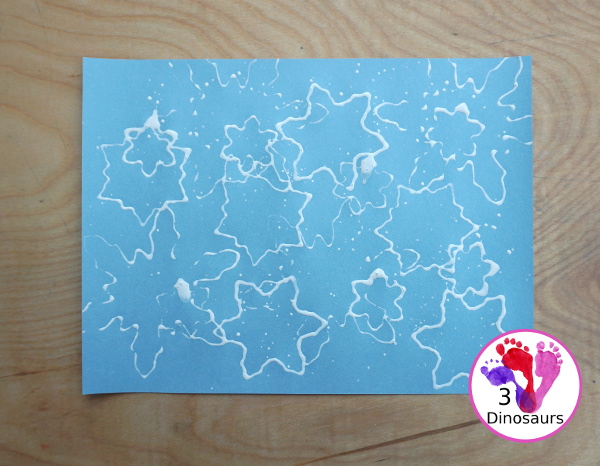 Making Snowflakes - Snowflake Cookie Cutter Painting - a simple painting craft that different ages of kids can do - 3Dinosaurs.com