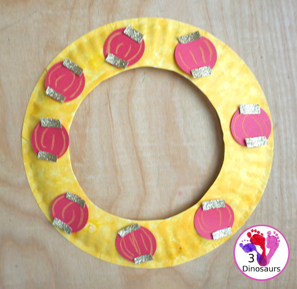 Lunar New Year Wreath Craft for kids - a simple paper plate wreath you can make with kids for the lunar new year and Chinese New year with a red lantern theme - 3Dinosaurs.com