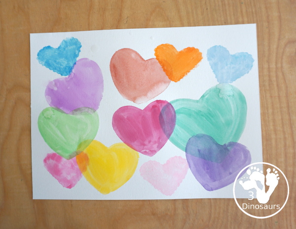 Watercolor Hearts Painting For Kids - a fun painting activity using watercolor and cookie cutters to make a really fun painting for Valentines - 3Dinosaurs.com
