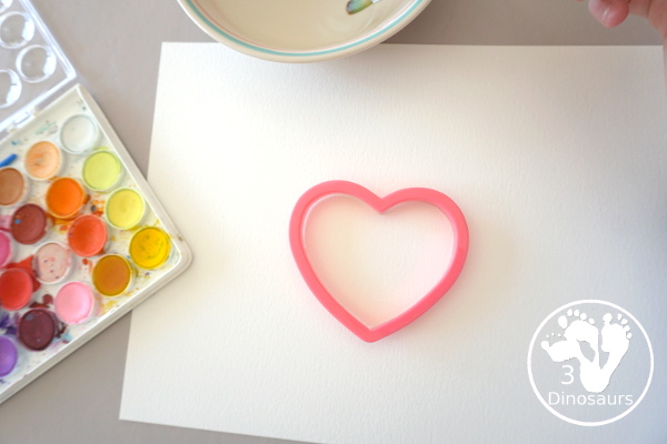 Watercolor Hearts Painting For Kids - a fun painting activity using watercolor and cookie cutters to make a really fun painting for Valentines - 3Dinosaurs.com