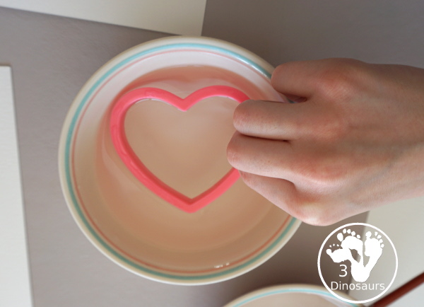 Watercolor Hearts Painting For Kids - a fun painting activity using watercolor and cookie cutters to make a really fun painting for Valentines - 3Dinosaurs.com