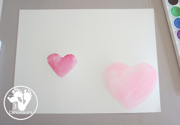 Watercolor Hearts Painting For Kids - a fun painting activity using watercolor and cookie cutters to make a really fun painting for Valentines - 3Dinosaurs.com