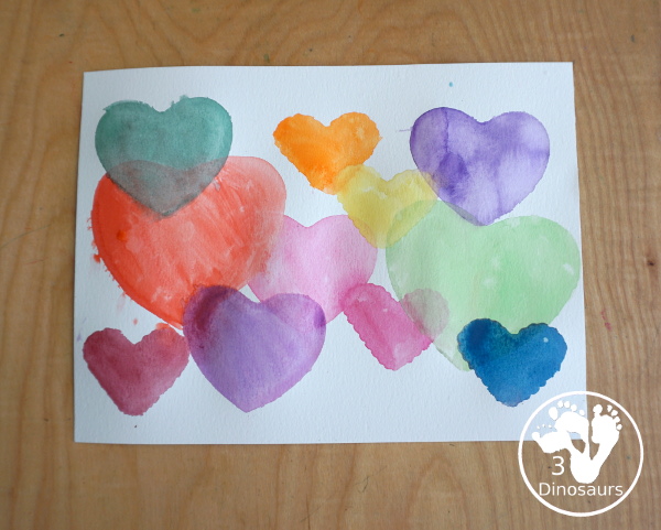 Watercolor Hearts Painting For Kids - a fun painting activity using watercolor and cookie cutters to make a really fun painting for Valentines - 3Dinosaurs.com