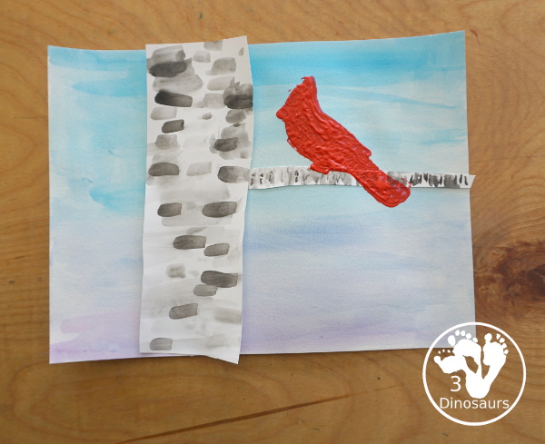 Winter Cardinal Painting for Kids is a great winter painting with watercolors, and cardinal cookie cutter to make a great winter painting. - 3Dinosaurs.com