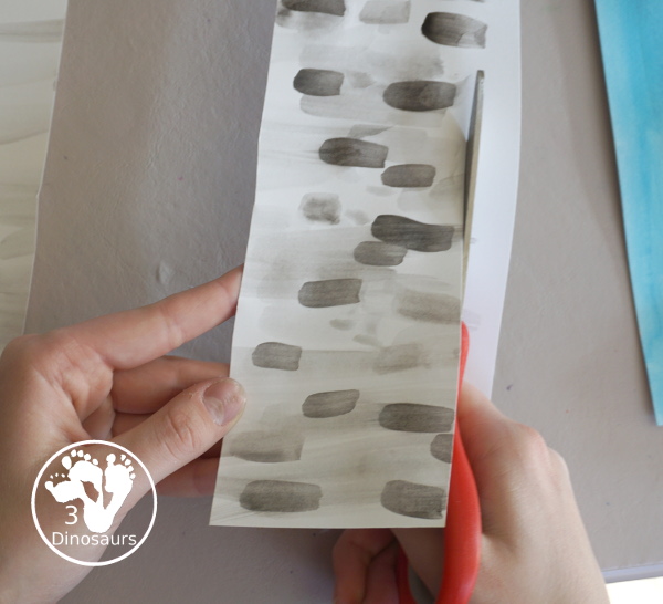 Winter Cardinal Painting for Kids is a great winter painting with watercolors, and cardinal cookie cutter to make a great winter painting. - 3Dinosaurs.com