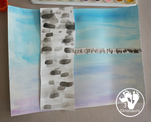 Winter Cardinal Painting for Kids is a great winter painting with watercolors, and cardinal cookie cutter to make a great winter painting. - 3Dinosaurs.com