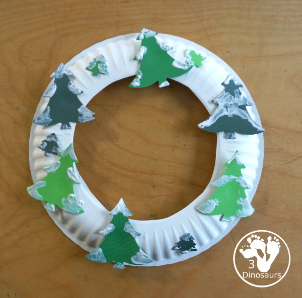 Winter Evergreen Tree Wreath Craft - a fun winter theme wreath with evergreen trees with white q-tip painting a fun craft for prek and kindergarten - 3Dinosaurs.com