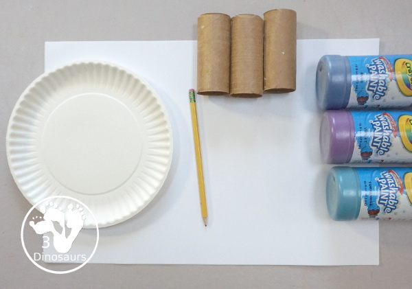 Paper Roll Painted Snowflake - a fun snowflake painting with blue and purple colors and using paper rolls to make the snowflakes. A simple and easy PreK and kindergarten craft for winter. - 3Dinosaurs.com