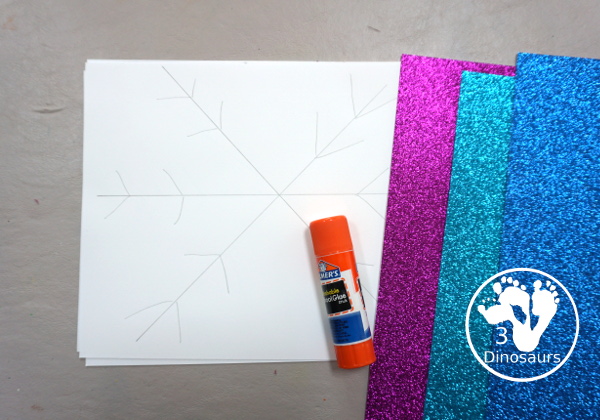 Torn Paper Glitter Snowflake Craft - a fun torn paper craft to make snowflakes out of glitter paper a fun winter craft for kids. - 3Dinosaurs.com
