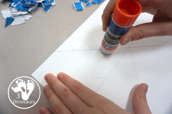 Torn Paper Glitter Snowflake Craft - a fun torn paper craft to make snowflakes out of glitter paper a fun winter craft for kids. - 3Dinosaurs.com