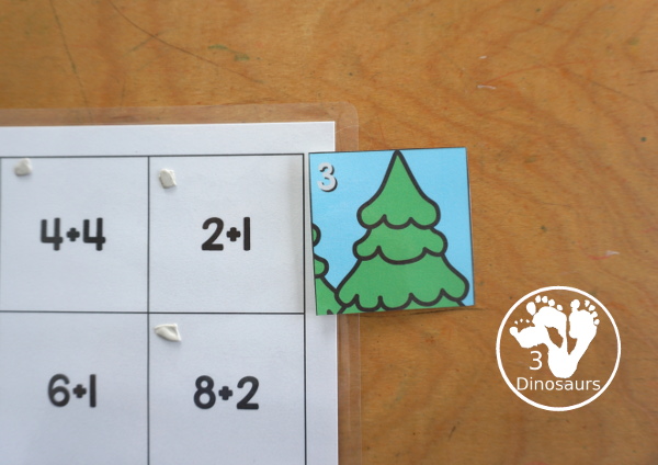 Free Hockey Addition Puzzle Printable - a fun 12 piece puzzle with addition from 1 to 12 on the puzzle mat with matching puzzle pieces. A fun winter sports theme for an addition center. - 3Dinosaurs.com