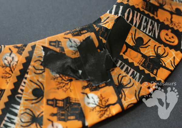 Fun Fine Motor Craft: Washi Tape Halloween Wreath - kids will get will work on fine motor skills while making a fun wreath for Halloween. - 3Dinosaurs.com