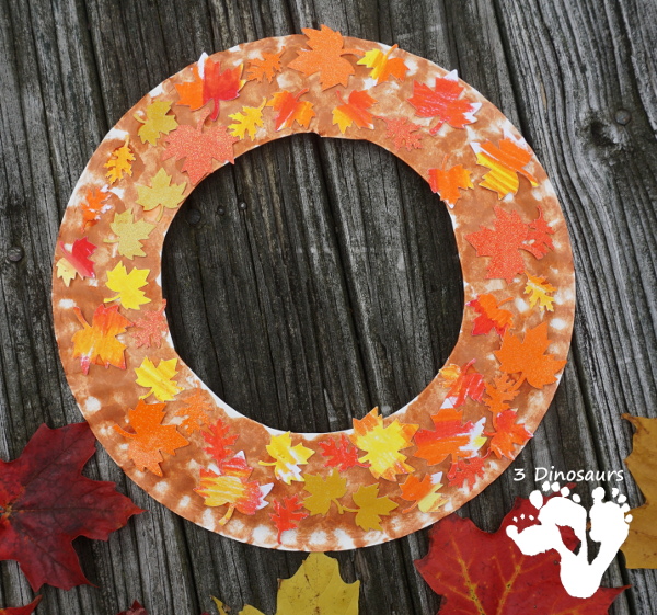 Fall Leaf Themed Wreath - fun wreath that kids can make with oil pastels and leaf punches - 3Dinosaurs.com