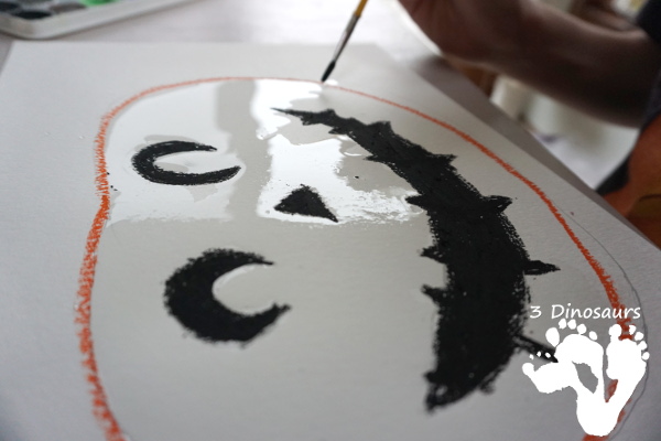 Watercolor Process Art Jack-O-Lantern - a fun Halloween painting activity to do with kids. It is great for kids that love to be creative and do things their own way - 3Dinosaurs.com