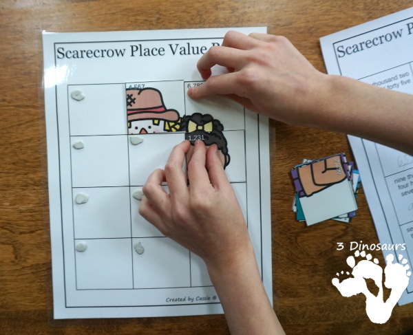 Free Scarecrow Place Value Puzzles - fun puzzles to work on place value with two options of tens and ones or thousand, hundreds, tens and ones with recording sheets, and puzzle mat - 3Dinosaurs.com