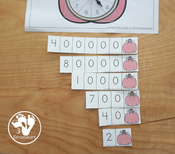 Free Pumpkin Spin & Write Place Value - You have 5 different spinners and 4 recording mats in color and black and white with place value from ones to Ones, Tens, Hundreds, Thousands, Ten Thousand, Hundred Thousands, Million, & Ten Million  - 3Dinosaurs.com