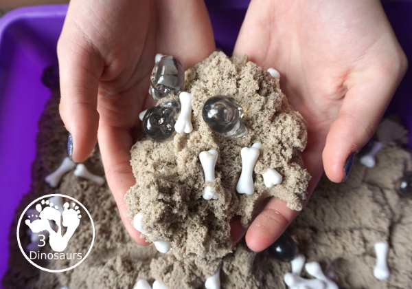 Bone Sensory Bin for Halloween - a fun kinetic sand sensory bin with a bone theme for Halloween - 3Dinosaurs.com