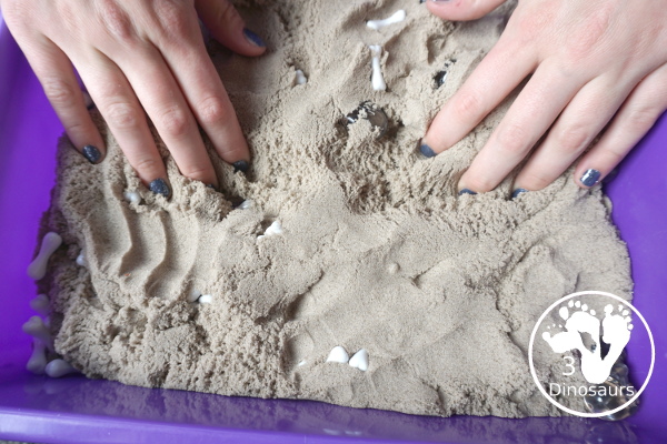 Bone Sensory Bin for Halloween - a fun kinetic sand sensory bin with a bone theme for Halloween - 3Dinosaurs.com