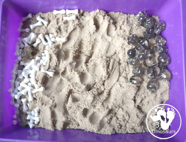 Bone Sensory Bin for Halloween - a fun kinetic sand sensory bin with a bone theme for Halloween - 3Dinosaurs.com