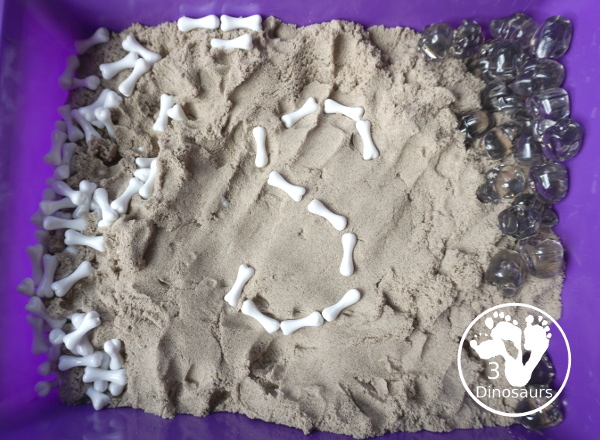 Bone Sensory Bin for Halloween - a fun kinetic sand sensory bin with a bone theme for Halloween - 3Dinosaurs.com