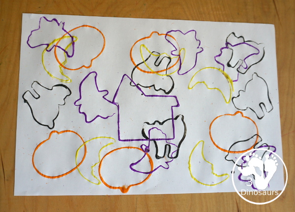 Halloween Stamping With Cookie Cutters - painting with cookie cutters using them to stamp paint with the cookie cutters on a piece of paper. A great tot, preschool and prek painting activity - 3Dinosaurs.com