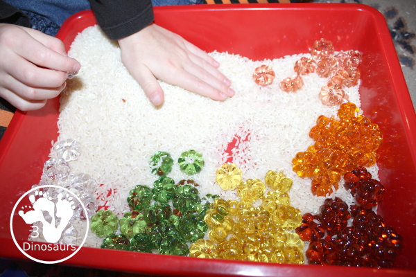 Pumpkin rice Sensory Bin - a simple rice sensory bin with pumpkins for a small sensory play for October and November - 3Dinosaurs.com