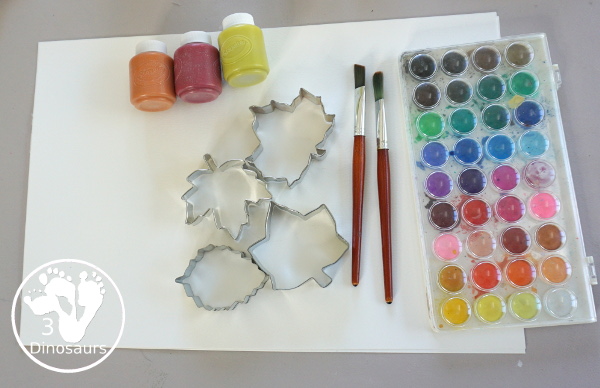 Fall Tree Scrape Painting with Leaf Cookie Cutters - a simple watercolor trunk and branches with leaf cookie cutter scrape painting. A great fall tree craft for kids.  3Dinosaurs.com