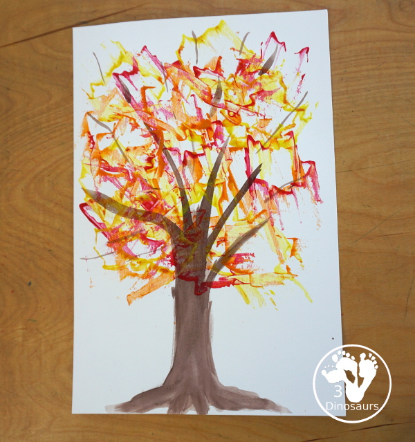 Fall Tree Scrape Painting with Leaf Cookie Cutters - a simple watercolor trunk and branches with leaf cookie cutter scrape painting. A great fall tree craft for kids.  3Dinosaurs.com