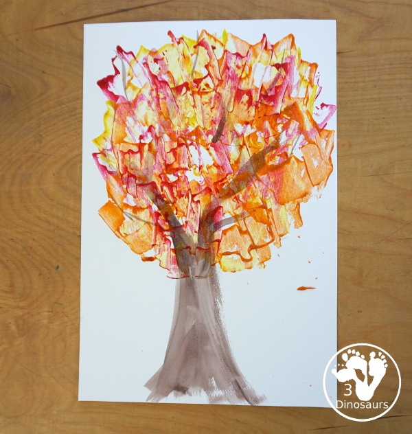 Fall Tree Scrape Painting with Leaf Cookie Cutters - a simple watercolor trunk and branches with leaf cookie cutter scrape painting. A great fall tree craft for kids.  3Dinosaurs.com