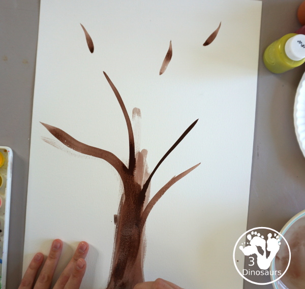 Fall Tree Scrape Painting with Leaf Cookie Cutters - a simple watercolor trunk and branches with leaf cookie cutter scrape painting. A great fall tree craft for kids.  3Dinosaurs.com