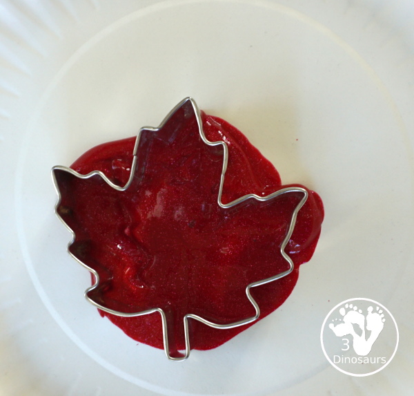 Fall Tree Scrape Painting with Leaf Cookie Cutters - a simple watercolor trunk and branches with leaf cookie cutter scrape painting. A great fall tree craft for kids.  3Dinosaurs.com