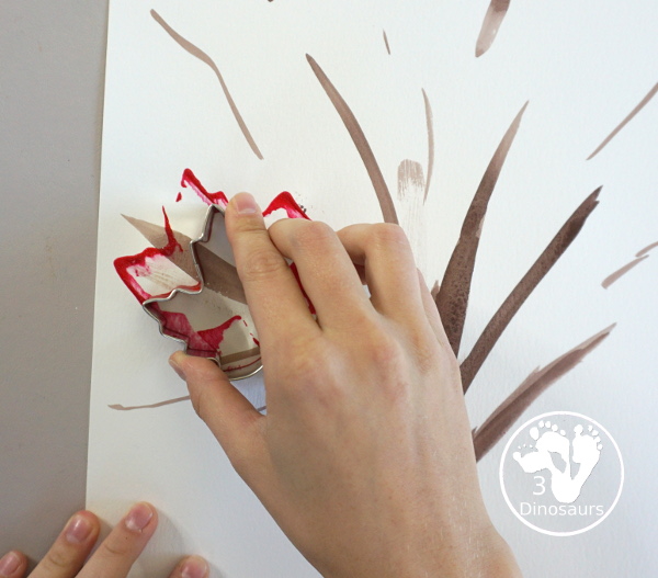 Fall Tree Scrape Painting with Leaf Cookie Cutters - a simple watercolor trunk and branches with leaf cookie cutter scrape painting. A great fall tree craft for kids.  3Dinosaurs.com