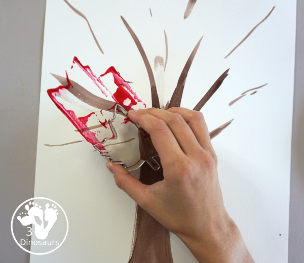 Fall Tree Scrape Painting with Leaf Cookie Cutters - a simple watercolor trunk and branches with leaf cookie cutter scrape painting. A great fall tree craft for kids.  3Dinosaurs.com