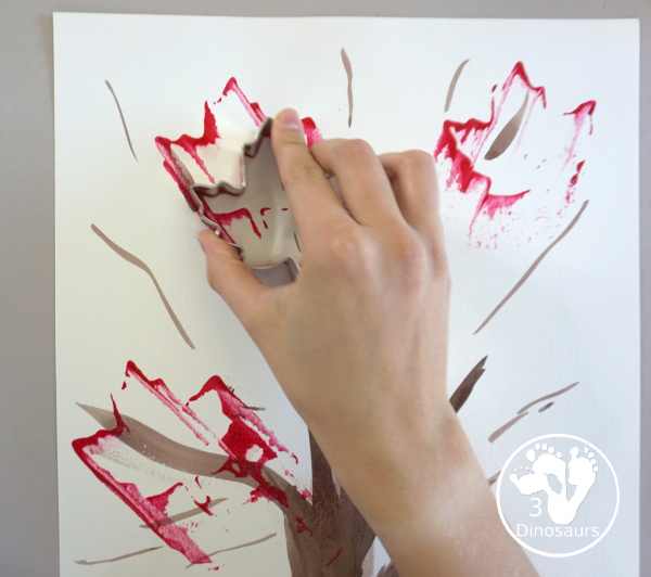 Fall Tree Scrape Painting with Leaf Cookie Cutters - a simple watercolor trunk and branches with leaf cookie cutter scrape painting. A great fall tree craft for kids.  3Dinosaurs.com
