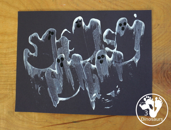 Ghost Scrape Painting with Cookie Cutters - a simple painting activity for kids with paint and ghost cookie cutters that different ages can make together for Halloween. - 3Dinosaurs.com
