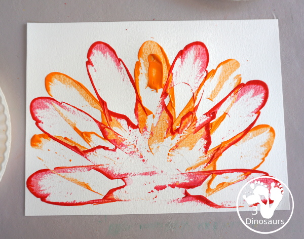 Turkey Feather Scrap Painting for Kids - a fun turkey craft made with a cookie cutter feather and construction paper. A fun painting idea with feathers for a Thanksgiving craft for kids in preschool, prek, and kindergarten. 3Dinosaurs.com