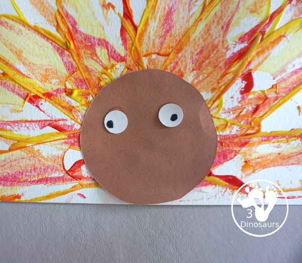 Turkey Feather Scrap Painting for Kids - a fun turkey craft made with a cookie cutter feather and construction paper. A fun painting idea with feathers for a Thanksgiving craft for kids in preschool, prek, and kindergarten. 3Dinosaurs.com