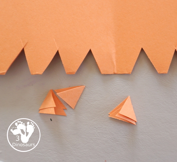 Turkey Feather Scrap Painting for Kids - a fun turkey craft made with a cookie cutter feather and construction paper. A fun painting idea with feathers for a Thanksgiving craft for kids in preschool, prek, and kindergarten. 3Dinosaurs.com