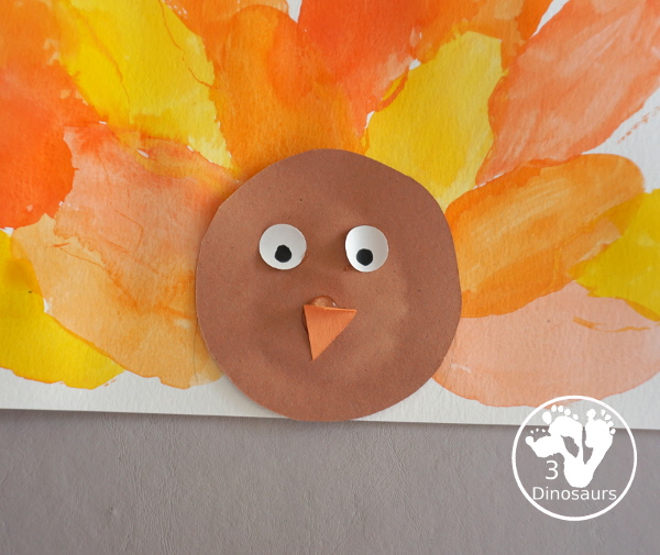 Turkey Feather Watercolor Painting for Kids - a fun turkey craft made with a cookie cutter feather and construction paper. A fun watercolor painting idea with feathers for a Thanksgiving craft for kids in preschool, prek, and kindergarten. 3Dinosaurs.co