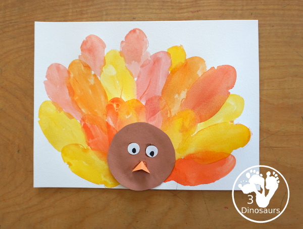 Turkey Feather Watercolor Painting for Kids - a fun turkey craft made with a cookie cutter feather and construction paper. A fun watercolor painting idea with feathers for a Thanksgiving craft for kids in preschool, prek, and kindergarten. 3Dinosaurs.co