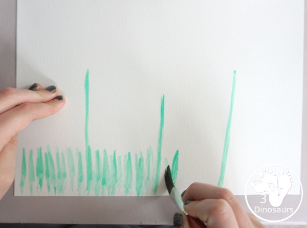 Watercolor Poppy Painting For Veteran's Day - a fun  watercolor painting using cookie cutters for the circle flowers and q-tip painting for the center. Simple and easy to do with kids. - 3Dinosaurs.com