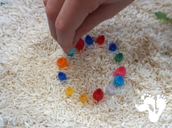 Christmas Lights & Rice Sensory Bin - simple and easy to set up sensor bin for kids to play in and great for sensory play - 3Dinosaurs.com