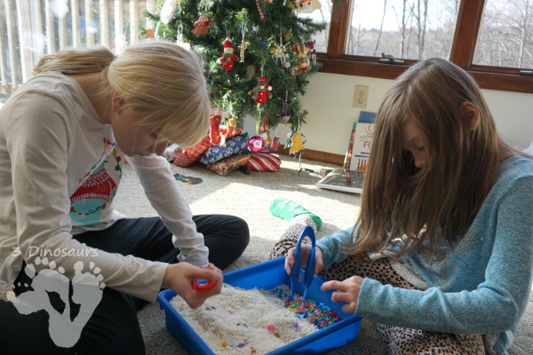 Christmas Lights & Rice Sensory Bin - simple and easy to set up sensor bin for kids to play in and great for sensory play - 3Dinosaurs.com