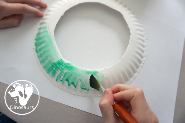 Christmas Ornament Wreath - a super easy wreath craft to make for Christmas - paint the paper plate with watercolors - 3Dinosaurs.com  