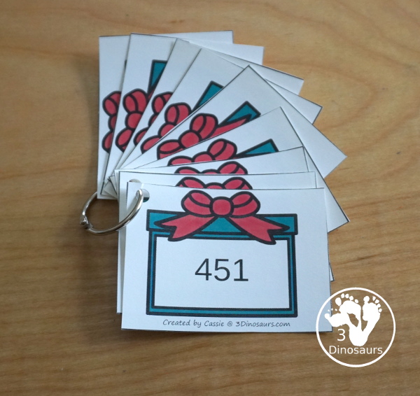 Free Christmas Themed Place Value Arrow Cards - work on building numbers from 0 to 9999 or 9999.99 to 0.99 with these Christmas Themed arrow cards. Plus use task cards to build the numbers. - 3Dinosaurs.com