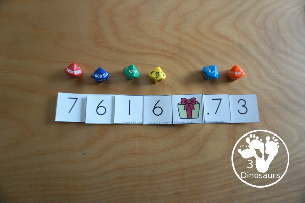 Free Christmas Themed Place Value Arrow Cards - work on building numbers from 0 to 9999 or 9999.99 to 0.99 with these Christmas Themed arrow cards. Plus use task cards to build the numbers. - 3Dinosaurs.com
