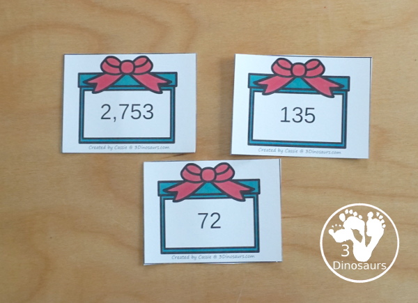 Free Christmas Themed Place Value Arrow Cards - work on building numbers from 0 to 9999 or 9999.99 to 0.99 with these Christmas Themed arrow cards. Plus use task cards to build the numbers. - 3Dinosaurs.com