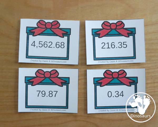 Free Christmas Themed Place Value Arrow Cards - work on building numbers from 0 to 9999 or 9999.99 to 0.99 with these Christmas Themed arrow cards. Plus use task cards to build the numbers. - 3Dinosaurs.com